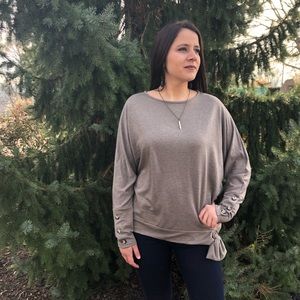Sweater with buttons on sleeves